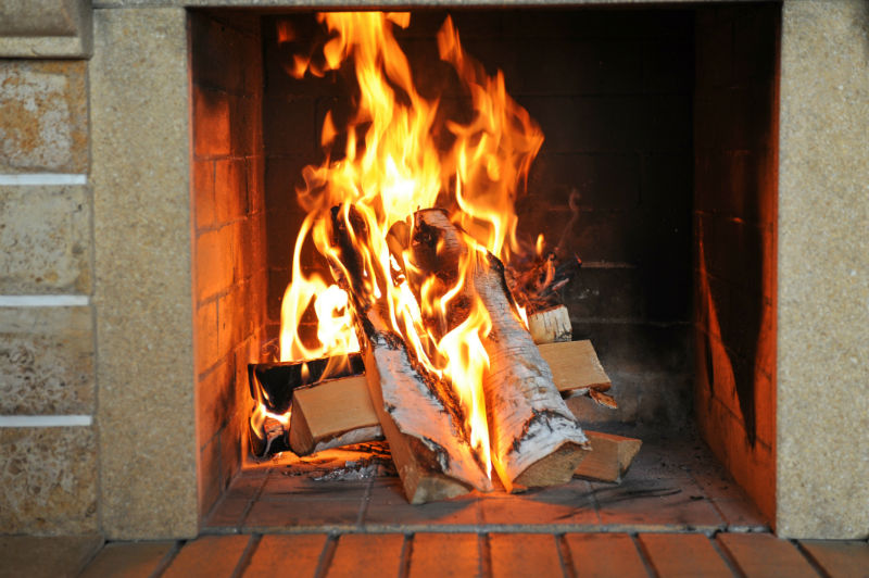 Close up of dazzling fire in a brick fireplace