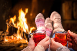 feet warming by fire
