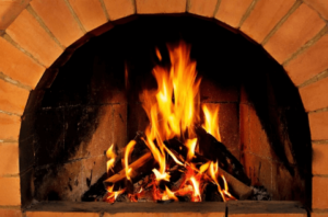 a roaring fires in a masonry fireplace