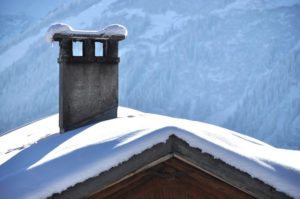 snow covered roof and chimney